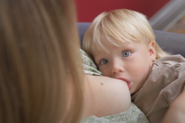 Image of mother breastfeeding child